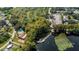 Aerial view of community pool, lake access, and RV park at 1120 Tartan Dr, Palm Harbor, FL 34684