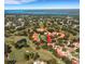 Aerial view of community near golf course and waterway at 1120 Tartan Dr, Palm Harbor, FL 34684