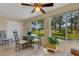 Cozy breakfast room with glass-top table and golf course view at 1120 Tartan Dr, Palm Harbor, FL 34684