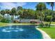 Highland Lakes Active Adult Golf Community entrance with fountain at 1120 Tartan Dr, Palm Harbor, FL 34684