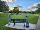 Relaxing bench overlooking a peaceful golf course at 1120 Tartan Dr, Palm Harbor, FL 34684