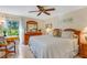 Spacious main bedroom with wood furniture and golf course view at 1120 Tartan Dr, Palm Harbor, FL 34684