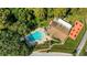 Aerial view of refreshing community pool with lounge chairs at 1120 Tartan Dr, Palm Harbor, FL 34684