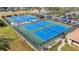 Well-maintained tennis courts with ample space at 1120 Tartan Dr, Palm Harbor, FL 34684