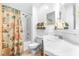 Bright bathroom with a bathtub, toilet, and vanity at 4043 Fox Ridge Blvd, Wesley Chapel, FL 33543