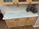 Kitchen counter with wood cabinets and decorative jars at 4043 Fox Ridge Blvd, Wesley Chapel, FL 33543