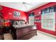 Spacious bedroom with a king-size bed and an Alabama Crimson Tide theme at 4202 W Culbreath Ave, Tampa, FL 33609