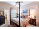 Comfortable bedroom with four-poster bed and en-suite bathroom access at 4202 W Culbreath Ave, Tampa, FL 33609