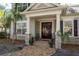 Elegant entryway with double doors, stone columns, and brick walkway at 4202 W Culbreath Ave, Tampa, FL 33609