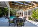 Charming patio with pergola, outdoor dining set, and pool views at 4202 W Culbreath Ave, Tampa, FL 33609