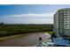 High-rise building with pool and pond views at 10851 Mangrove Cay Ne Ln # 1112, St Petersburg, FL 33716