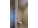 Small half bathroom with toilet and tile floor at 10851 Mangrove Cay Ne Ln # 1112, St Petersburg, FL 33716