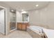 Elegant bathroom with soaking tub, shower, and double vanity at 10851 Mangrove Cay Ne Ln # 1112, St Petersburg, FL 33716