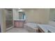 Bathroom with soaking tub, shower, and double vanity at 10851 Mangrove Cay Ne Ln # 1112, St Petersburg, FL 33716