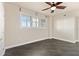 Spacious bedroom with dark tile flooring and large window at 10851 Mangrove Cay Ne Ln # 1112, St Petersburg, FL 33716