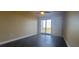 Bedroom with tile floors and sliding glass door to balcony at 10851 Mangrove Cay Ne Ln # 1112, St Petersburg, FL 33716