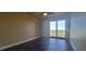 Bedroom with tile floors and balcony access with water view at 10851 Mangrove Cay Ne Ln # 1112, St Petersburg, FL 33716