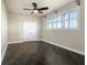 Spacious bedroom with ceiling fan and large windows at 10851 Mangrove Cay Ne Ln # 1112, St Petersburg, FL 33716