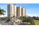 Front view of a modern high rise building with gated entrance at 10851 Mangrove Cay Ne Ln # 1112, St Petersburg, FL 33716