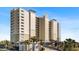 Condo building exterior, featuring attractive architecture and landscaping at 10851 Mangrove Cay Ne Ln # 1112, St Petersburg, FL 33716