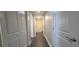 Hallway with tile floors and access to laundry at 10851 Mangrove Cay Ne Ln # 1112, St Petersburg, FL 33716