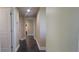 Long hallway with tile floors and neutral walls at 10851 Mangrove Cay Ne Ln # 1112, St Petersburg, FL 33716