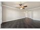 Open living room with hardwood floors and access to hallway at 10851 Mangrove Cay Ne Ln # 1112, St Petersburg, FL 33716