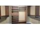 Large walk-in closet with shelving and hanging rods at 10851 Mangrove Cay Ne Ln # 1112, St Petersburg, FL 33716