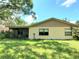 Ranch-style home with screened porch and spacious lawn at 10960 Echo Loop, New Port Richey, FL 34654