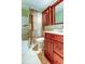 Bathroom includes wood vanity and shower/tub combo at 1747 Douglas Ave, Dunedin, FL 34698