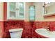 Small bathroom with updated fixtures and red tile at 1747 Douglas Ave, Dunedin, FL 34698