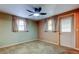 Spacious bedroom with ceiling fan and neutral walls at 1747 Douglas Ave, Dunedin, FL 34698