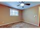 Simple bedroom with carpet flooring and ceiling fan at 1747 Douglas Ave, Dunedin, FL 34698