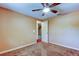 Simple bedroom with carpet flooring and ceiling fan at 1747 Douglas Ave, Dunedin, FL 34698