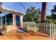 Back deck with access to backyard and exterior door at 1747 Douglas Ave, Dunedin, FL 34698