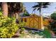 Cute yellow storage shed in the backyard at 1747 Douglas Ave, Dunedin, FL 34698