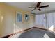 Sunroom featuring a ceiling fan and window at 1747 Douglas Ave, Dunedin, FL 34698