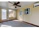 Bright sunroom with window, door and ceiling fan at 1747 Douglas Ave, Dunedin, FL 34698