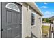 Dark gray front door with arched window detail at 205 W 122Nd Ave, Tampa, FL 33612