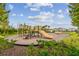 Playground area with multiple playsets and a climbing structure at 33055 Tulip Petal Ln, Wesley Chapel, FL 33545