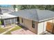 Aerial view showcasing home's backyard and screened-in porch at 3722 Village Estates Pl, Tampa, FL 33618