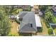 Aerial view of house, showing roofline, backyard, and landscaping at 3722 Village Estates Pl, Tampa, FL 33618