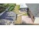 Aerial view shows house, shed, patio, and screened enclosure at 3722 Village Estates Pl, Tampa, FL 33618