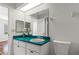 Clean bathroom with teal countertop and updated vanity at 3722 Village Estates Pl, Tampa, FL 33618