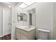 Bathroom with a vanity, toilet, and mirrored medicine cabinet at 3722 Village Estates Pl, Tampa, FL 33618