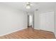 Light-filled bedroom with wood flooring and double closets at 3722 Village Estates Pl, Tampa, FL 33618