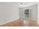 Bright bedroom with laminate wood flooring and ceiling fan at 3722 Village Estates Pl, Tampa, FL 33618