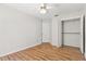 Bedroom with laminate wood floor, ceiling fan, and closet at 3722 Village Estates Pl, Tampa, FL 33618