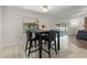 Cozy dining area with a black table and four chairs at 3722 Village Estates Pl, Tampa, FL 33618