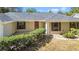 Front view of a single-story house with a tiled entryway at 3722 Village Estates Pl, Tampa, FL 33618